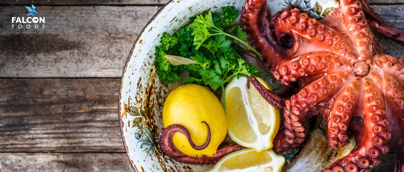 Freshly prepared octopus dish with lemon and parsley on rustic plate, featuring Falcon Foods branding, representing vibrant and appetizing food industry web design.